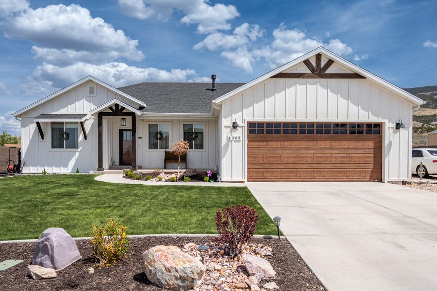 Custom beauty with breathtaking views & designer touches & upgrades throughout! This stunning 3 bedroom, 2 bath custom home with office space looks straight out of a model home, every room showcases exceptional attention to detail & craftsmanship. The warm & inviting living area features gorgeous brickwork framing the fireplace, seamlessly echoing the custom brick backsplash in the kitchen. You'll love the open layout, ideal for both comfortable living & effortless entertaining. Step outside to your own private oasis! The covered back patio offers a perfect spot to relax & take in the amazing mountain views. Situated on a fully fenced ½ acre lot with block walls, the yard has been professionally landscaped to perfection including a built-in custom BBQ & outdoor kitchen a charming bridge feature, and a cozy firepit area with a stunning custom outdoor fireplace. This home is truly one-of-a-kind blending luxury, comfort, and outdoor living at its finest. Come see the magic for yourself!