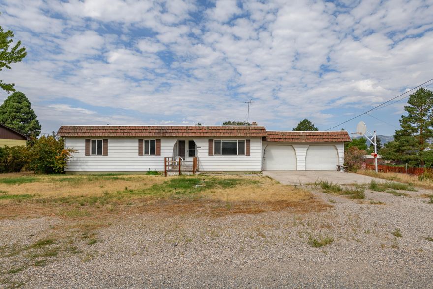 Calling all do-it-yourselfers—this classic handyman special is ready for fresh ideas and sweat equity. With 5 bedrooms and plenty of square footage, there's room to stretch out, and the unfinished basement is waiting for your personal touch. A wood-burning stove brings cozy character, while the covered back deck and patio look out over a huge yard that's wide open for your vision.