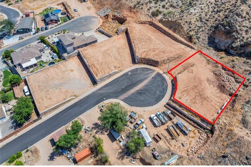 This 0.24-acre lot is part of four contiguous parcels, offering endless potential. It's the perfect place to build your dream home, surrounded by peaceful desert landscapes and breathtaking views. You also have the option to add an accessory dwelling unit (ADU) for additional living space or rental income. For builders and developers, these lots offer excellent investment potential and back up to an incredible ridgeline that enhances privacy and scenic value. With no HOA and the ability to bring your own builder, the possibilities are wide open. Located near Zion National Park, Sand Hollow, Warner Valley, sand dunes, and world-class outdoor recreation, this is a rare opportunity to create something truly special. Buyer/buyer agent is responsible for verifying all information.