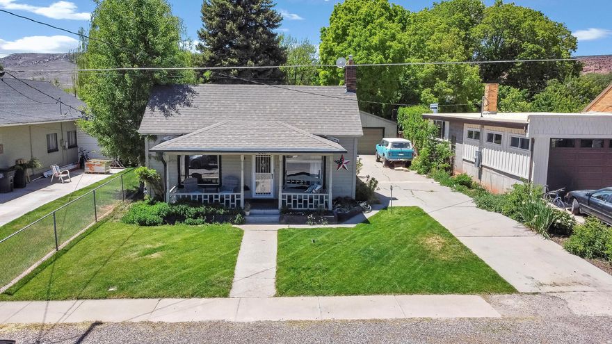 This adorable west-side cottage is full of charm, character, and opportunity. Featuring 3 bedrooms, 1 bath, great storage, a huge laundry room, an awesome 2-car garage, and a secluded private backyard, this sweet home is just waiting for someone to make it their own. So much potential in such a cozy and inviting space -- and 100% financing options may be available for qualified buyers, making it a fantastic opportunity for first-time homebuyers.