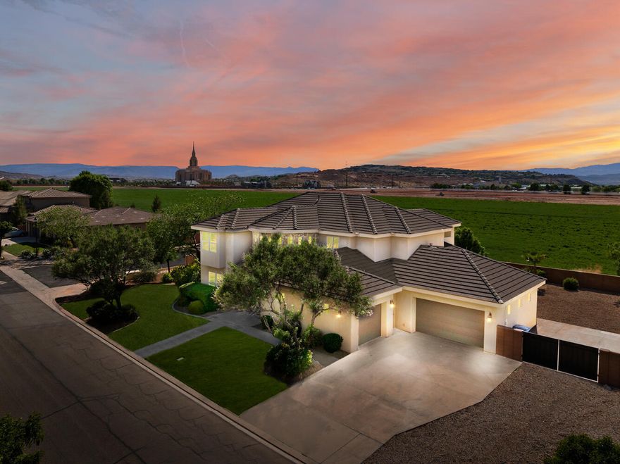 Enjoy peaceful living with room to grow in this beautifully renovated 5-bedroom home in the scenic Daybreak Park subdivision of Washington Fields. Set on a spacious 0.38-acre lot with open views, this home blends modern upgrades with timeless comfort.
Step inside to soaring ceilings, brand-new paint, and stylish new flooring throughout. The dramatic two-story foyer welcomes you with natural light, a grand staircase, and a seamless flow into the living room—where a floor-to-ceiling fireplace anchors the space. The open layout extends to a formal dining area and out to a private patio, perfect for entertaining. The kitchen comes with high-end appliances, granite countertops, a large breakfast bar, custom tile backsplash, and dual Bosch wall ovens. The main-level primary suite offers a spa-like retreat with patio access, soaking tub, walk-in shower, dual vanities, and an organized closet. You'll also find a dedicated office, additional room, powder bath and mudroom on this floor.
Upstairs includes three spacious bedroomsone with a private en-suite, and two sharing a Jack-and-Jill bathplus a laundry room and a covered balcony with views. The oversized 3-car garage includes rear access and extra space for storage or hobbies.  The large yard has room for a pool, includes RV parking and gated access. 
Located within the highly rated Crimson Cliffs High boundaries and just steps from Washington Fields Intermediate, this home is also near the community park, riding trails, and Southern Utah's favorite outdoor playgrounds: Quail Creek, Sand Hollow, and Zion.
This is a home that feels as good as it looksmove-in ready and made for living.