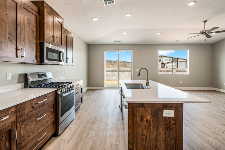 New home in a non-HOA development, offering refined living with the freedom to personalize! Finishing construction, this 3-bedroom, 2-bathroom 2 Car Garage home perfectly blends comfort and functionality. Enjoy beautiful quartz countertops, soft-close doors and drawers, a stunning tile primary shower, durable LVP flooring, and stylish two-tone paint. Added privacy and security with rear and side wall already included. Don't miss the chance to own a brand-new home in a community where you have the freedom to make it yours! Photos are of a similar home, contact one of our agents today to find out how you may customize this home to your style Hurry in today!