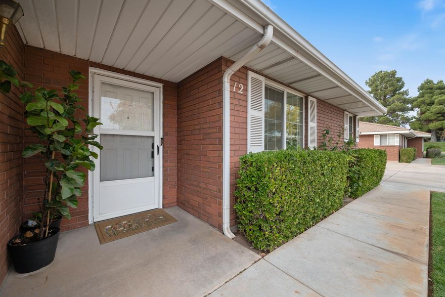 Just steps from the HOA pool, this charming single-level brick home offers easy living. With 2 beds, 2 baths, and an attached 2-car garage, it's the kind of place that feels just right - whether you're looking to simplify, downsize, or land somewhere central. Over the past five years, the home has seen some smart updates: a new heat pump, energy-efficient windows, sliding glass doors, and a kitchen refresh featuring quartz countertops, stainless appliances, new tile flooring, and plenty of storage. The layout feels open and bright, and every room is move-in ready. The HOA takes care of yard maintenance, so you can spend more time doing what you love. Shopping, dining, and daily essentials are all just minutes away. Clean, updated, and in a prime St. George location, this is easy to enjoy!