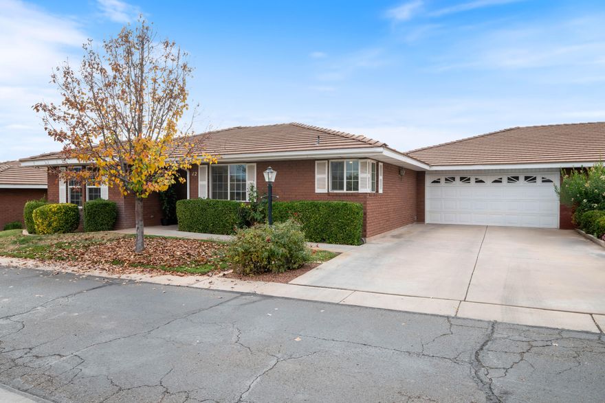 Just steps from the HOA pool, this charming single-level brick home offers easy living. With 2 beds, 2 baths, and an attached 2-car garage, it's the kind of place that feels just right - whether you're looking to simplify, downsize, or land somewhere central. Over the past five years, the home has seen some smart updates: a new heat pump, energy-efficient windows, sliding glass doors, and a kitchen refresh featuring quartz countertops, stainless appliances, new tile flooring, and plenty of storage. The layout feels open and bright, and every room is move-in ready. The HOA takes care of yard maintenance, so you can spend more time doing what you love. Shopping, dining, and daily essentials are all just minutes away. Clean, updated, and in a prime St. George location, this is easy to enjoy!