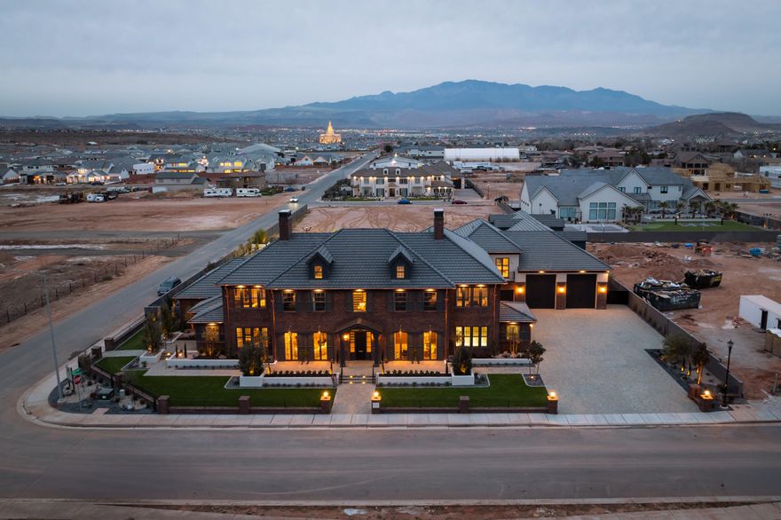 Welcome to McAllister Manor, where legendary inspiration meets extraordinary luxury.Designed as a playful tribute to the classic film Home Alone, this breathtaking 13,915 sq. ft. estate by Strata Homes is a show-stopping centerpiece of the 2026 Parade of Homes. With a front façade that mirrors the iconic movie residence, this home delivers nostalgic charm wrapped in uncompromising modern elegance.
McAllister Manor features 6 bedrooms, 8.5 bathrooms, and a floorplan crafted for both grand entertaining and everyday comfort. The main level is anchored by a luxurious primary suite and includes a private office, art room, and an attached casita perfect for guests or multigenerational living.
*Furniture is available for purchase Expansive living areas flow seamlessly to the backyard oasis, complete with a resort-style pool and a fully equipped outdoor kitchen.

The second floor is built for lifestyle and leisure, offering a state-of-the-art home theater, fully appointed gym, and beautifully designed secondary bedrooms and gathering spaces. And then there's the top floor, reserved entirely for fun and imagination: a whimsical private attic retreat known as "Kevin's Room," an unforgettable nod to the home's cinematic roots.

For the ultimate in recreation, the property boasts a full sports court with its own lounge area, creating a year-round hub for games, fitness, and entertaining. Car enthusiasts will appreciate the impressive 8-car garage, providing abundant space for vehicles, toys, and storage.

Every corner of McAllister Manor reflects meticulous craftsmanship, high-end finishes, and thoughtful design. Equal parts sophisticated and playful, this is more than a luxury home. It's a destination, a conversation piece, and a once-in-a-lifetime opportunity.