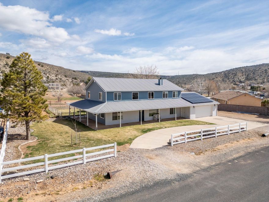 Welcome to Diamond Valley living at its finest - a charming, spacious home waiting to entertain, relax, & embrace country-inspired freedom. Just 15 minutes from downtown St. George, you'll enjoy COOLER TEMPS & easy access to everything the area offers. From the moment you arrive, the CIRCULAR DRIVE & WRAP-AROUND PORCH welcome you with curb appeal & practical ease. This well-maintained home blends THOUGHTFUL DESIGN WITH MODERN UPDATES. MAIN-LEVEL LIVING with a generously sized OVERSIZED PRIMARY SUITE & an open-concept bathroom, plus plenty of space to spread out both upstairs & down. Boasting TWO GATHERING SPACES with a newly added LOFT for flexible living, recreation, or work-from-home space. Pristine layout designed for hosting & everyday comfort. A LARGE, UPDATED KITCHEN featuring double ovens, perfect for daily meals or entertaining guests. Numerous UPDATES THROUGHOUT including EXTERIOR PAINT, SIDING & SOFFIT, MOST WINDOWS REPLACED, FRESH INTERIOR PAINT, NEW CARPET, & AN UPGRADED HALF BATH. Abundant storage, including TWO LARGE STORAGE ROOMS at the back of the garage. You'll also love the outdoor & lifestyle perks that set this home apart. On an ALMOST-ACRE LOT there are lots of options available to you. A FENCED GRASS AREA in the backyard, SOLAR PANELS that help offset utility costs, HORSE & ANIMAL PRIVILEGES, a garden plot, chicken coop, RV PARKING, & SPACE TO BUILD a detached garage or an ADU. Offering ample space for gatherings, play, & pets. NO REAR NEIGHBORS mean VIEWS & privacy as you enjoy the outdoors. NO HOA restrictions, offering flexibility & fewer rules. Don't miss the BEST PRICED HOME IN DIAMOND VALLEY! Sellers open to short leaseback.