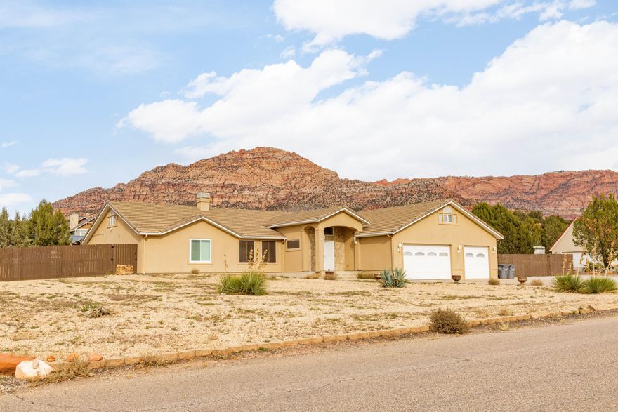 Enjoy space, freedom, and unforgettable views in this Apple Valley retreat set on nearly an acre with full fencing. Take in breathtaking red rock scenery from every angle, with no HOA to limit your lifestyle. Parking galore with extensive concrete and an oversized 3-car garage offering extra width and depth. Two bonus storage rooms—one inside the home and one in the garage—provide exceptional functionality. Features include a large laundry room and generator for added peace of mind. Room to spread out, store toys, and truly just be.