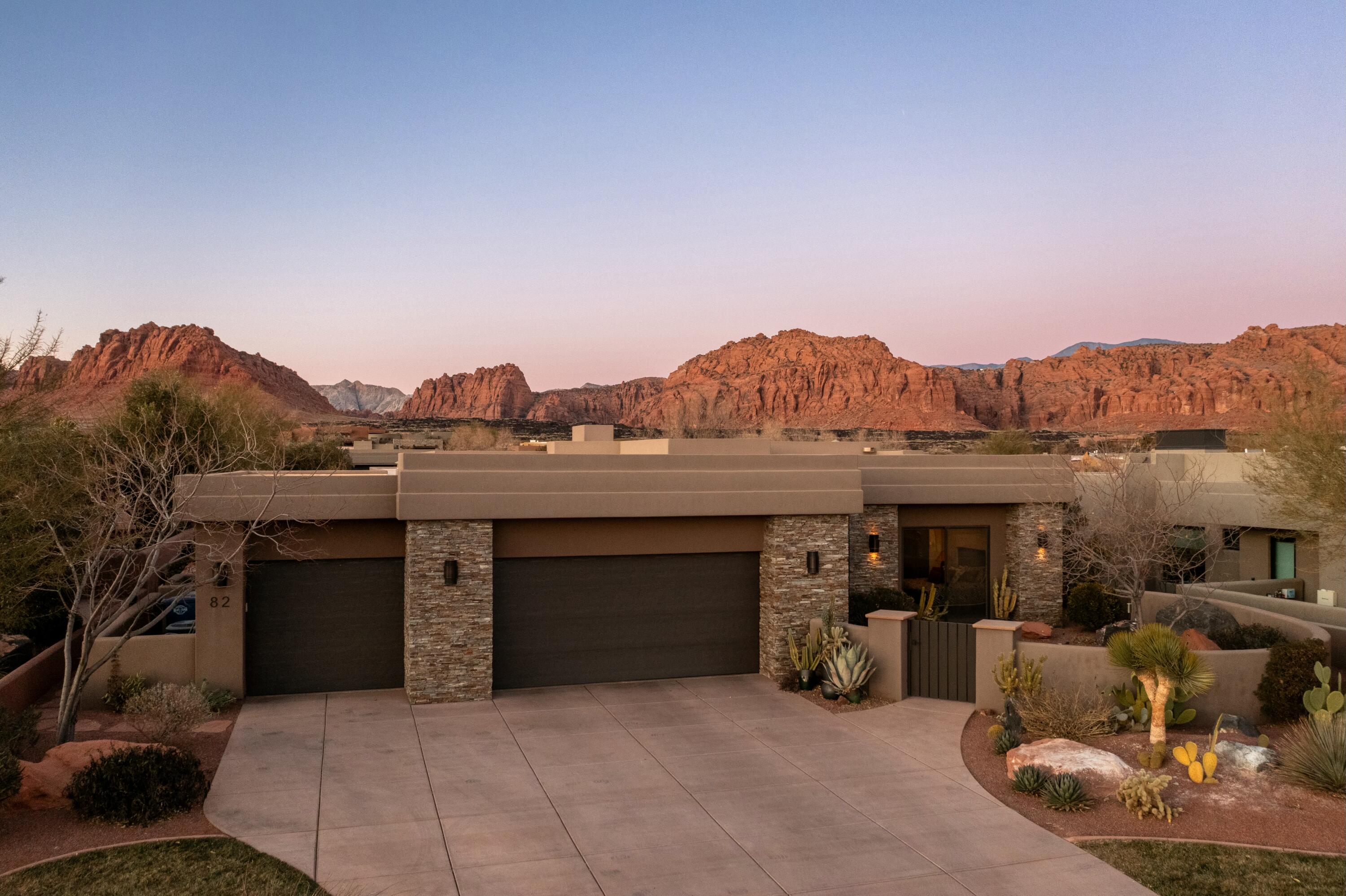 Nestled within the prestigious Reserve at Entrada, this stunning 4-bedroom, 3-bathroom home offers 2,457 square feet of modern luxury with unparalleled views of the breathtaking Snow Canyon. The open-concept floor plan seamlessly blends indoor and outdoor living, with expansive windows framing the red rock vistas.
Step outside to your private desert oasis, featuring a sparkling pool, a tranquil water feature, and a cozy outdoor fire pit, perfect for entertaining or relaxing under the starry skies. The home boasts elegant finishes throughout, with a gourmet kitchen, spa-like bathrooms, and spacious bedrooms designed for comfort.
Situated in one of Southern Utahs most coveted communities, this home offers both serenity and sophistication in an unforgettable setting.