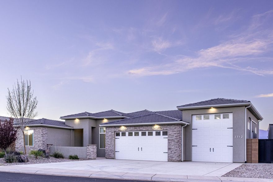 Wake up, load the toys, and be on the water or the trails in minutes. Located near Sand Hollow Reservoir and endless 4x4 trails, this Dixie Springs home offers quick access to boating, fishing, wake surfing, wakeboarding, jet skis, and off-road adventures.

The standout feature is the rare 31' pull-through RV garage with 10'x12' doors, complete with 2 240V outlets, climate control, and epoxy floors. Perfect for storing all your toys and adventure gear. Extra storage above 2 bay garage. The property also includes gated access from the backyard to the street behind the lot, adding extra convenience for parking, access, or storing recreation vehicles.

Inside you'll find quality finishes and a functional layout, including 11' ceilings in living area, 9' ceilings in bedrooms, wide plank tile flooring, spacious room sizes, and a desirable split floor plan offering privacy and comfortable living. The kitchen features a built-in range, RO water system, custom hood, and hidden pantry for a clean, modern look with great storage.

The primary bathroom offers flexibility with a large shower and room to add a vanity or tub of your choice. Enjoy views of Pine Valley Mountain from the large covered patio, perfect for relaxing in the shade and watching the sunset.

Another benefit of living in Dixie Springs is power through Dixie Power, known for some of the lowest electricity rates in the nation.