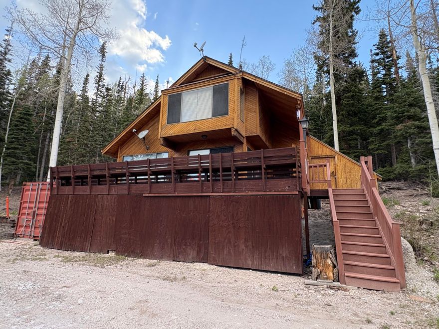 Enjoy panoramic views and vibrant sunsets overlooking Eagle Point Resort's Black Diamond runs. This mountain cabin sits on 1.26 acres with easy access from Hwy 153.

The open floor plan features high ceilings and a spacious deck for extended outdoor living. Most furnishings stay, including new kitchen appliances and log furniture in the master bedroom. Includes a storage shed and pod.

Recent foundation and water system repairs—details in Seller's Disclosures. Easy to show—your perfect mountain getaway awaits!