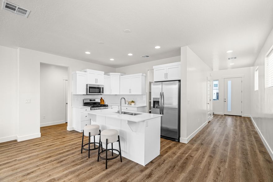 4 bed with Primary on the main level, 2.5 bath home with a 2-car garage in the brand-new Desert Reflection community by Salisbury Homes. Features include EVP flooring in main living areas and bathrooms, upgraded carpet in bedrooms, quartz countertops throughout, stainless steel gas appliances (fridge not included), modern cabinets, and kitchen backsplash. Community park, trails, and amenities nearby. NOTE: Interior and exterior finishes are predetermined and may change. Photos are examples of the finishes are also subject to change. TAKE ADVANTAGE OF A $10,000 LENDER INCENTIVE AND GET A LOWER RATE! Buyer/agent to verify all info.