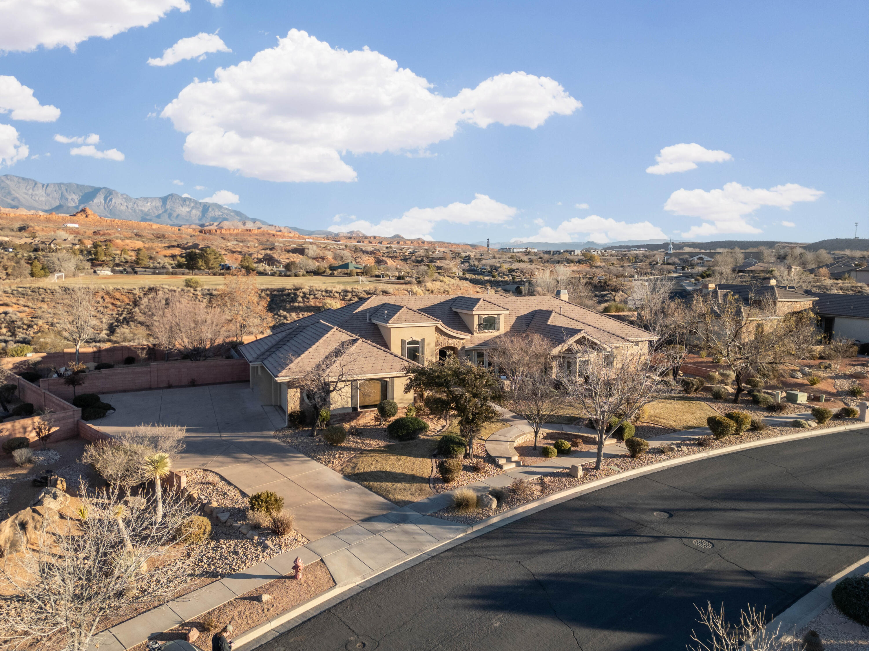 Looking for European charm in the heart of the Southern Utah desert? This beautiful 3,613 sq foot home is for YOU! Single level living. Large lot including pool and inground hot tub, large covered decks, separate fenced grassy areas, mature manicured landscaping and private fenced courtyard off the front casita entrance. 4 car garage with wrap around cabinetry. Interiors found in the nicest of homes including crown molding, high ceilings, view windows, tile, quartz, wood flooring, upgraded modern lighting with programmable settings for your mood and safety, custom cabinetry, 4 bedrooms with ensuites and an additional half bath. Special features are attached in the document section and include programmable speakers for music, a large screen and projector for movies and/or home business meetings, casita with exterior and interior access,  apartment with kitchenette with exterior and interior access, solar panels paid for and included, programmable security system with cameras paid for and included, and open cabinetry/shelving around the custom fireplace and sitting rooms. Homes of this caliber are hard to find. Please call the agent for a showing. The home is not occupied and can be easily shown.

Information is deemed to be reliable. Buyer(s) and buyer's agent to verify all information.