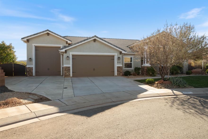 Nestled in the desirable Stucki Farms area, this 4-bedroom, 2.5-bath former builder's model home is packed with upgrades and thoughtful details throughout. Enjoy an open floor plan, upgraded finishes, 2x6 exterior walls, a radiant barrier, a reverse osmosis system, a large pantry, Everlights, and two covered patios for year-round outdoor living. The 38' heated and cooled RV garage is a standout; ideal for RVs, toys, storage, workshop, and includes built-in storage. The flexible 4th bedroom can serve as an office. Outdoor enthusiasts will love the location, ride ATVs straight from your garage to miles of Warner Valley trails, with Sand Hollow just over the hill for boating and water fun. The fully enclosed backyard with great mountain views and no backyard neighbors. Minutes from SR-7, close to great amenities, convenient to the airport, located in Dixie Power, and move-in ready.