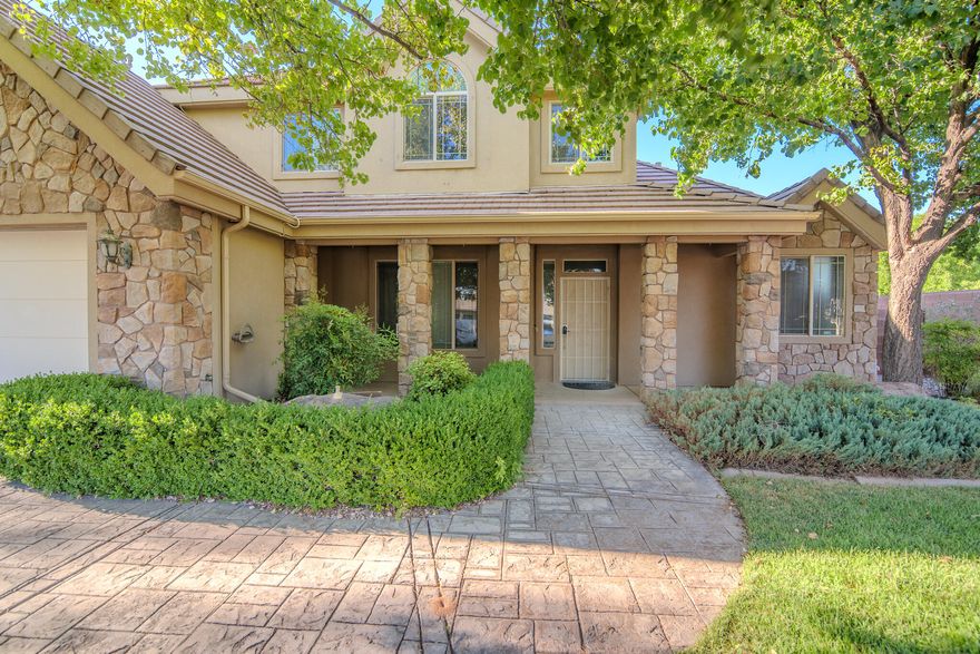 This spacious 4-bedroom, 3-bathroom home in St. George sits on nearly a half-acre and offers incredible space both inside and out. Featuring an open floor plan with wood floors, a cozy gas fireplace, and new carpet in the family room. Upstairs boasts new laminate flooring for a fresh, modern touch. The attached 3-car garage is complemented by a detached 3-car garage with RV parking and an interior workshop—perfect for projects or extra storage. The home also has the GlowLight system installed. Enjoy room to grow, play, and create in this thoughtfully designed home with exceptional functionality and charm.