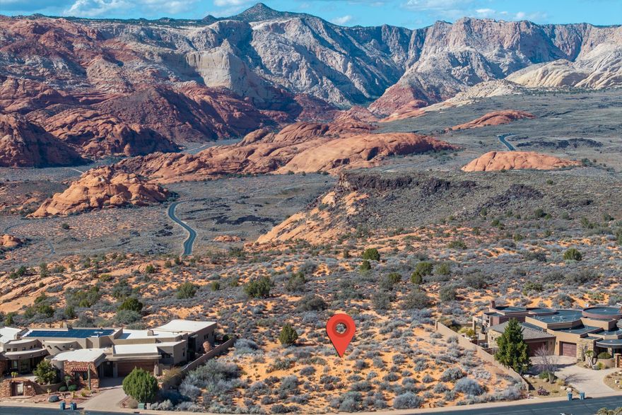 Rare opportunity to own one of the final premier rim lots backing directly to Snow Canyon State Park. This .59-acre parcel provides a private, unobstructed vantage point over iconic red rock cliffs, ancient lava flows, and sandstone formations. Located within the secure, gated Ledges community, the property offers a protected natural backdrop that ensures no future development will ever mar your views. The flexible topography perfectly suits a sleek single-level ranch or a sophisticated multi-level estate with a walk-out basement. Enjoy elite resort living with access to the 18-hole championship golf course, clubhouse, and miles of hiking and biking trails. Secure your place on the rim where the landscape defines your lifestyle. Call/text listing agents for viewing instructions.