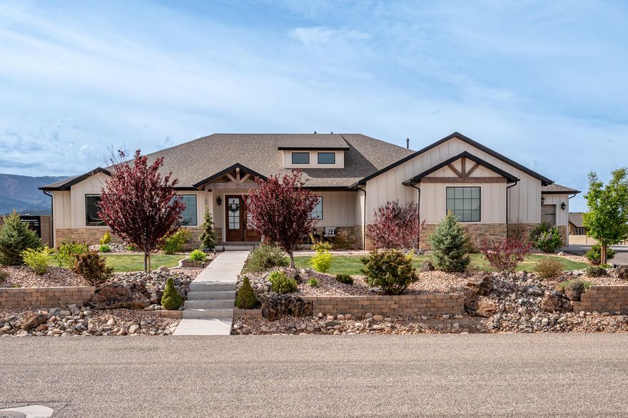 Stunning open-concept home on over an acre in 4B Ranches with breathtaking views of Shirtz Canyon! The incredible great room features open beams, built-in cabinetry, and a show-stopping fireplace. High-end finishes throughout, including a gourmet kitchen with quartz countertops, a huge island, and a spacious butler's pantry. Luxurious main-level primary suite with direct access to the laundry room. Huge sunny office with built in bookcases. Fully finished basement offers a second laundry room and 3 additional bedrooms. Oversized garage with an extra-deep third bay for all your toys. Side RV parking with hookups, block wall fencing, and a professionally landscaped yard complete with a pickleball court. A rare find!