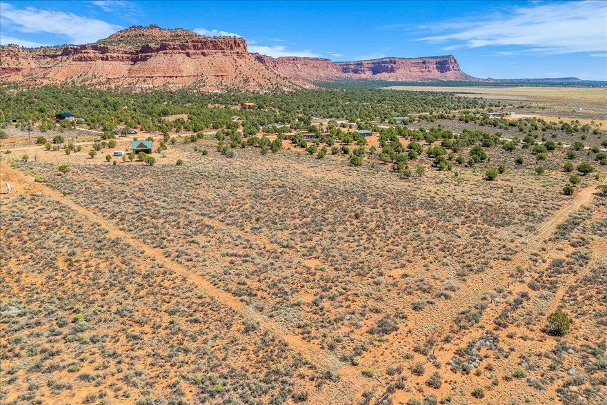 Discover nearly 10 acres of prime land for sale in Kanab UT. Offering unobstructed red rock views, wide-open space, and endless potential for your custom home, ranch, or retreat. Just minutes from downtown Kanab, this scenic parcel combines peaceful rural living with convenient access to shops, restaurants, and outdoor recreation. All major utilities are available, power is ready, and city water and septic are at the street, making this property truly build-ready. The expansive acreage allows for horses, gardens, or hobby farming, and provides multiple flat building sites to take advantage of the surrounding views. Whether you're seeking an investment property, vacation getaway, or a forever home site, this Kanab acreage delivers the ideal blend of privacy, accessibility & natural beauty!