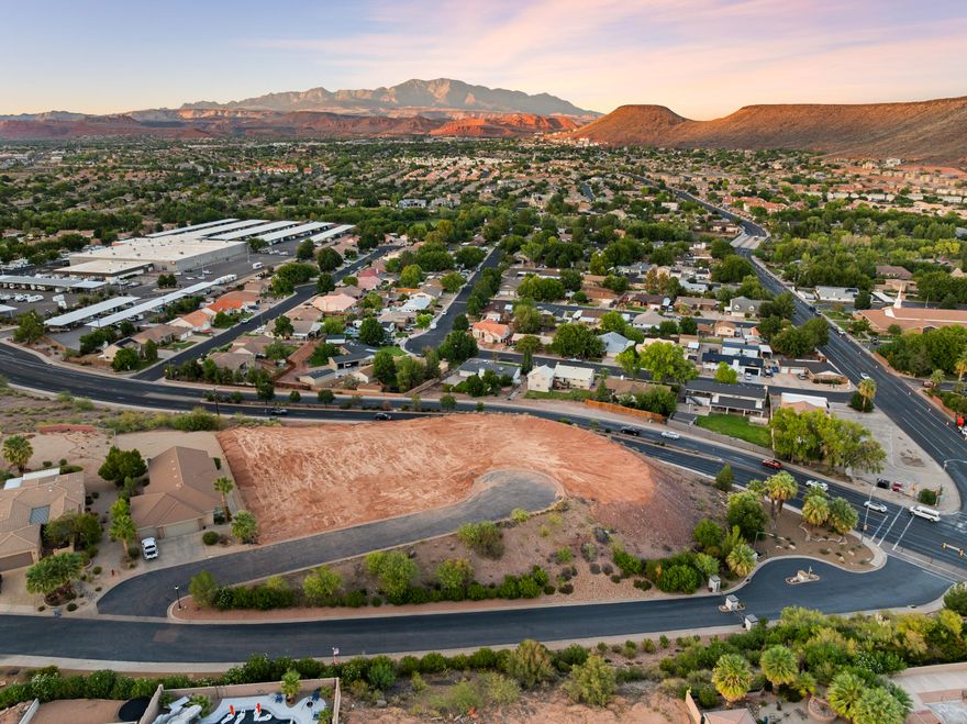 Views are everything here — and Lot 20 has them. This .23-acre parcel in the Crown Point subdivision sits in St. George with unobstructed views of Pine Valley, Snow Canyon, and Red Mountain. Positioned at the end of a cul-de-sac, the lot provides both privacy and a stunning natural backdrop. Pad-ready, with a full soils engineer report, you'll enjoy a head start on the build process. You can design a home that frames those views exactly the way you want. Adjacent lots are available to make almost one acre of buildable land! Inquiry for special pricing for purchasing all three. HOA fee includes water for the home and landscaping.