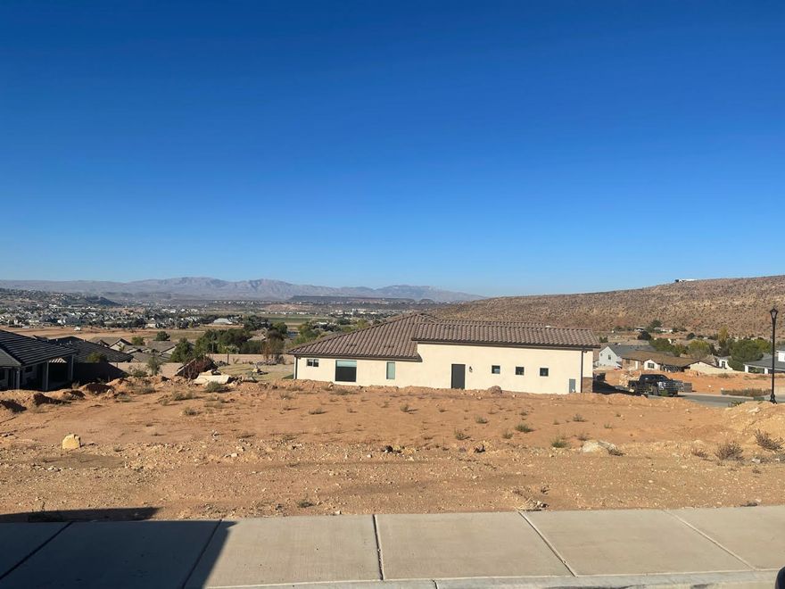 Walk-Out Basement lot with amazing views. Located in a quiet neighborhood on the East Bench of Washington. Quick, easy access to grocery stores. Dixie Power. OWNER AGENT