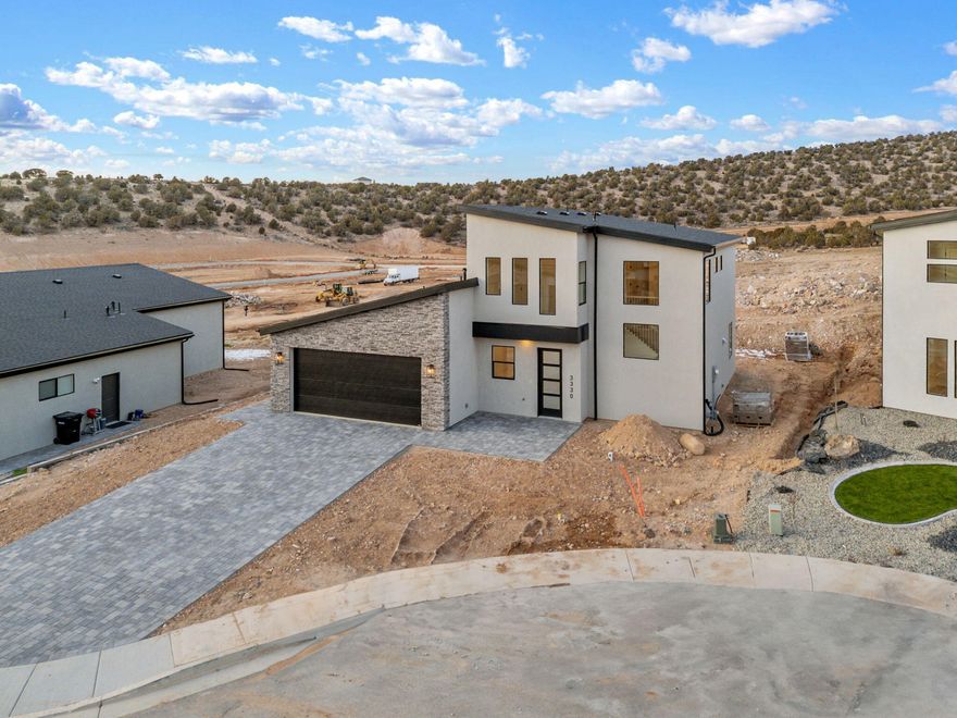 Situated in the new Valley at South Mountain community, this contemporary two -story home offers a well-designed open floor plan ideal for modern living. The layout includes 4 bedrooms, 2 full bathrooms, and 1 half bath, along with a 2 care garage. Interior finished feature LVT flooring, tile, carpet, and quartz countertops, creating a modern, lo-maintenance living space. Enjoy scenic views of Shurtz Canyon, no HOA, and quick access to I-15, nearby and future shopping centers, and full front zero scape landscape and paved driveway. A great opportunity to own a new build in a growing South Mountain neighborhood with both comfort and convenience in mind.