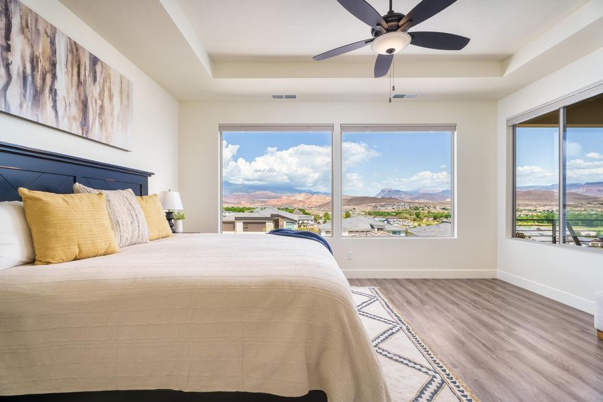 Now offering an EXCLUSIVE RATE & PAYMENT with Preferred Lender! This home is a must see, with MILLION DOLLAR VIEWS for under a million. Located in the desirable Zion Vista community, this home has stunning 180 degree views of Pine Valley Mountain, Coral Cliffs, Kolob, Hurricane Mesa, Zion National Park and overlooks the Hurricane Valley below. Enjoy the tinkling lights of Hurricane City at night. With the primary bedroom on the main floor, you have everything you need without using stairs. In the walk-out basement, you have a second kitchen, 2 oversized bedrooms plus a den, laundry connections and full bathroom, perfect for young adults, mother-in-law or renters. Enjoy the view from the covered deck and well manicured yard, complete with a gas fire pit and hot tub. The garage is setup perfectly to be a shop or extra room, conveniently fitted with a separating wall, door and mini split. Come check this one out before its gone!