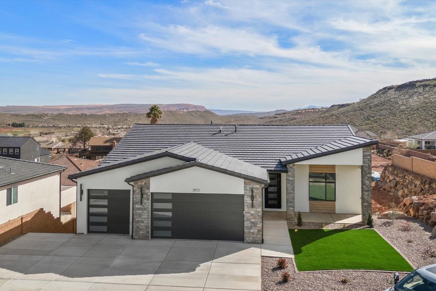 Stunning 2026 new construction in the desirable Coral Canyon community of Burke Springs in St. George! This modern home offers 6 bedrooms, 4 bathrooms, and a private ADU—perfect for guests, multi-generational living, or rental income. Eye-catching contemporary exterior with stone accents and great curb appeal. Inside, enjoy a bright, open-concept layout with spacious living areas ideal for entertaining. Quality finishes and thoughtful design throughout. Low-maintenance desert landscaping, generous driveway, and ample garage space. Close to golf, hiking, and all the outdoor recreation Southern Utah is known for. A rare opportunity in a sought-after neighborhood!