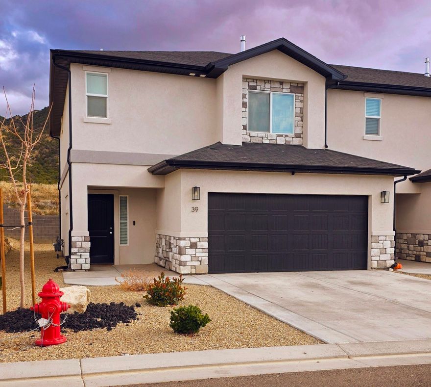 Move fast on this beautiful end unit townhome in Shadow Cove off Fiddlers Canyon. This move in ready home features 3 bedrooms, 2.5 baths and 1734 sqft with granite counters, a cozy fireplace, 9 ft ceilings and ceiling fans in every room. The open layout offers great storage throughout and the fenced patio showcases amazing mountain views. The larger lot gives added space and privacy. HOA covers grounds, snow removal, water, trash and sewer. Includes refrigerator, range, microwave, washer, dryer, dishwasher and window coverings. Community amenities include a basketball court, playground, dog park, pickleball and a covered pavilion. Great location close to dining, shopping and schools. This is a well cared for home and a must see!