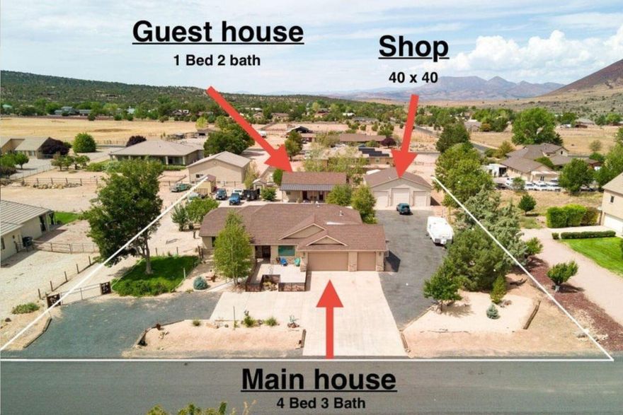 Ask about VA assumable loan. Discover the perfect blend of privacy and convenience with this beautiful property just outside the city—close enough for an easy commute, yet offering the peace and space of country living. 4 Bed 3 Bath Main house, 40 x 40 3 bay SHOP, and a 1 Bed 2 Bath Guest home all situated on a 0.92 acre lot with mature landscaping, this home has been thoughtfully updated and is ready for you to move in and enjoy. Not to mention two RV hookups on the north side of the property.

The separate 1-bedroom, 2-bathroom GUEST HOUSE complete with its own kitchen—perfect for extended family, guests, or even rental potential. The oversized 3-car garage AND 3 bay shop provides plenty of room for vehicles, hobbies, and storage, complemented by two additional sheds for all your tools and gear. Outdoor living shines here with a large covered porch, ideal for relaxing and taking in the peaceful surroundings. For added peace of mind, security doors are installed on both the front and back entrances.

Recent updates to the property include: 
Floors throughout home, Fireplace, barn wood, Railings front & back, Security doors front & back, Driveway, Back (Mother-in-Law home) 976 sq. ft., 2 Sheds, Fencing, Roof over back porch, HVAC system - 3 years old, Septic upgraded to 1500 gal, Water heater 2 years old, Sprinkler & drip system, Master bath remodel and a new dishwasher as of last year.

This property combines practical features with timeless charm, don't miss the chance to make it your own! No HOA.