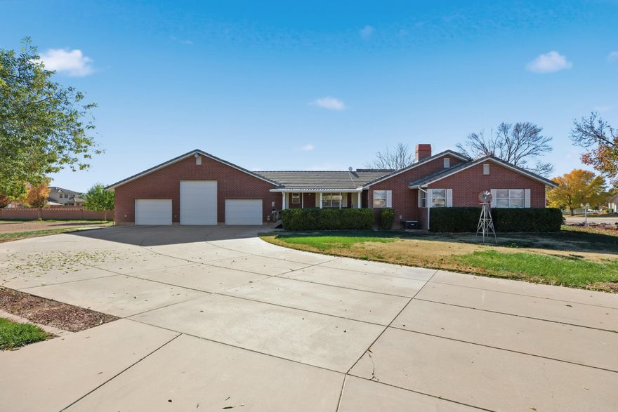 Nice home situated on nearly 1 acre with horse privileges and an included irrigation water share. This property features a huge garage with a center RV door, offering excellent space for vehicles, toys, or a workshop. Enjoy the benefit of wide-open space while still being conveniently located close to shopping, dining, and other everyday amenities. A great opportunity for those seeking room to spread out with added functionality.