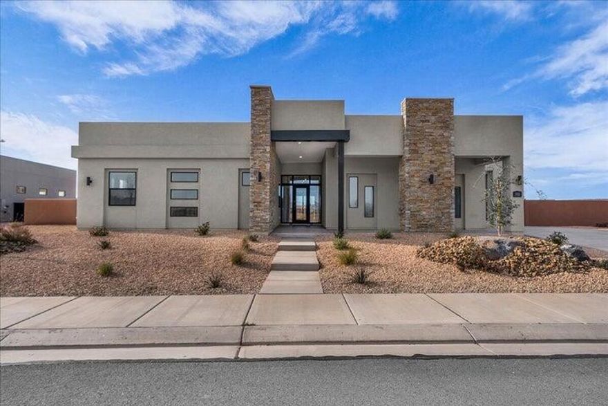 Experience luxury living at 3322 Guide Star Way in the highly sought-after Estates at Sand Hollow. This beautiful move-in-ready home from the Luxe Collection offers the perfect blend of comfort, quality, and Southern Utah lifestyle. The Aspen plan by Carefree Homes features 2,619 square feet with 4 bedrooms, 3.5 bathrooms, and a spacious open-concept layout ideal for both everyday living and entertaining. Enjoy a gourmet kitchen, expansive primary suite, and retractable floor-to-ceiling patio glass doors that seamlessly connect indoor and outdoor living. High-end features include 10' ceilings, 8' doors, 2x6 construction, upgraded LVP flooring throughout the great room, hallways, and bathrooms, and pre-wiring for four zones of surround sound. The impressive 40' RV garage includes signature built-in shelving and epoxy floors, while full 360° low-maintenance landscaping and window coverings make this home truly move-in ready. Monthly HOA fees include access to Sand Hollow Resort amenities, along with discounted golf rates and exclusive events, offering a lifestyle that combines luxury, recreation, and convenience in one exceptional home.