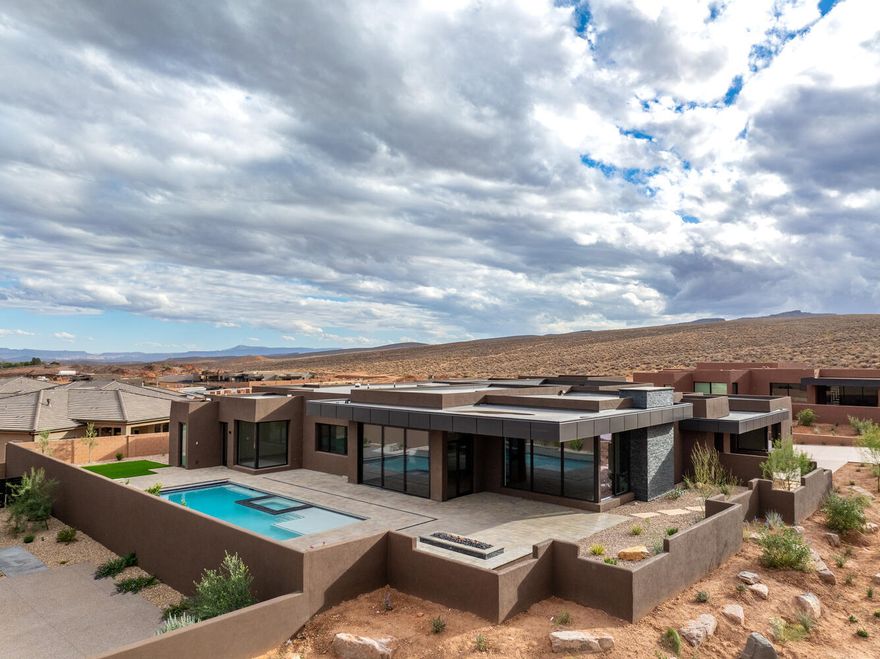 Located in scenic Ivins, this brand-new luxury home offers a rare combination of desert modern design, unobstructed red rock views, a spacious open floor plan with a private casita, a pool and hot tub, and a large RV garage. 

The open-concept layout creates effortless flow between the kitchen, dining, and living areas—ideal for both relaxed living and easy entertaining. The home features four spacious bedrooms, each with its own ensuite bath, including a private casita with a kitchenette and separate entrance—perfect for guests or multi-generational needs.

 .41 acre lot provides generous outdoor space with an in-ground pool, hot tub, and fire pit - all oriented to capture the beauty of the surrounding landscape. And, the 44 ft RV garage provides room for all your toys! Owner/Agent