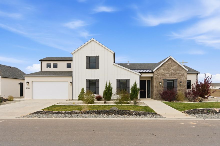 This beautiful brand-new home in the highly sought-after Painted Desert Subdivision offers modern farmhouse charm with thoughtful design throughout. Sitting on a .40-acre corner lot, the property is fully landscaped & move-in ready. With 5 bedrooms, 3.5 bathrooms, and 2,820 sq ft, this home offers a spacious, open floor plan perfect for everyday living & entertaining. The inviting living room features floor-to-almost-ceiling sliding doors, flooding the space with natural light & providing a beautiful view of the covered patio and backyard. A cozy fireplace with built-in shelves & cabinets adds warmth & function. The kitchen has modern finishes, a large walk-in pantry, & an easy flow into the dining and family areas. An office/den is conveniently located off the entryway, providing a quiet workspace or flex room. Upstairs, you'll find a second family room above the garage - complete with its own bathroom - making it ideal for guests, recreation, or a media room. The primary suite offers a relaxing retreat with a spacious walk-in closet, dual sinks, and a large walk-in shower. Parking and storage are abundant with a deep 3-car attached garage plus a 2-car detached garage, perfect for vehicles, toys, or a workshop. Located just minutes from Cedar City and convenient to shopping, dining, and outdoor recreation. New, never occupied - a rare opportunity in one of the area's premier new communities!