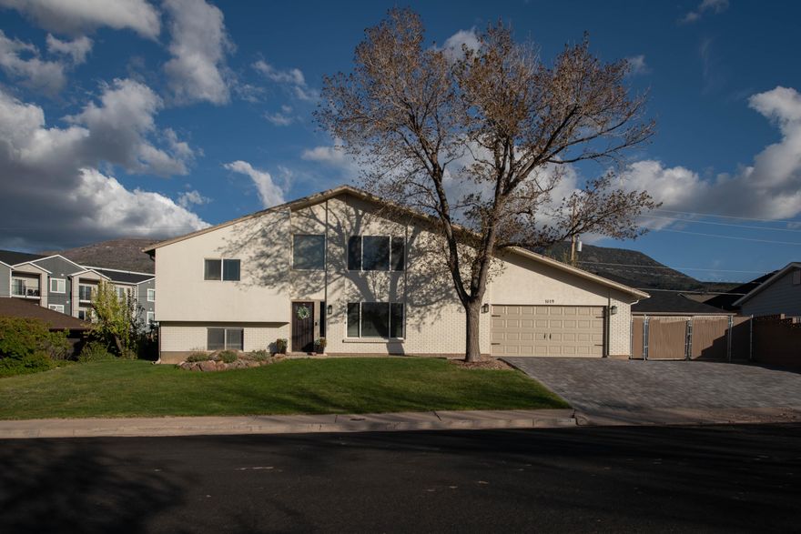 LOCATION LOCATION LOCATION!! Updated home in a prime Cedar City location just minutes from Cedar High School and downtown. This property features new kitchen appliances and countertops, fresh exterior paint, pavers in the driveway, and a concrete pad in the backyard. Inside, enjoy tall ceilings and large windows that bring in so much natural light, creating an open, inviting feel. Spacious rooms and large closets provide plenty of storage and comfort. Stay warm with a dual fireplace upstairs and a woodstove downstairs, adding charm and efficiency. A great opportunity to own a well-located home with meaningful updates and standout features.
