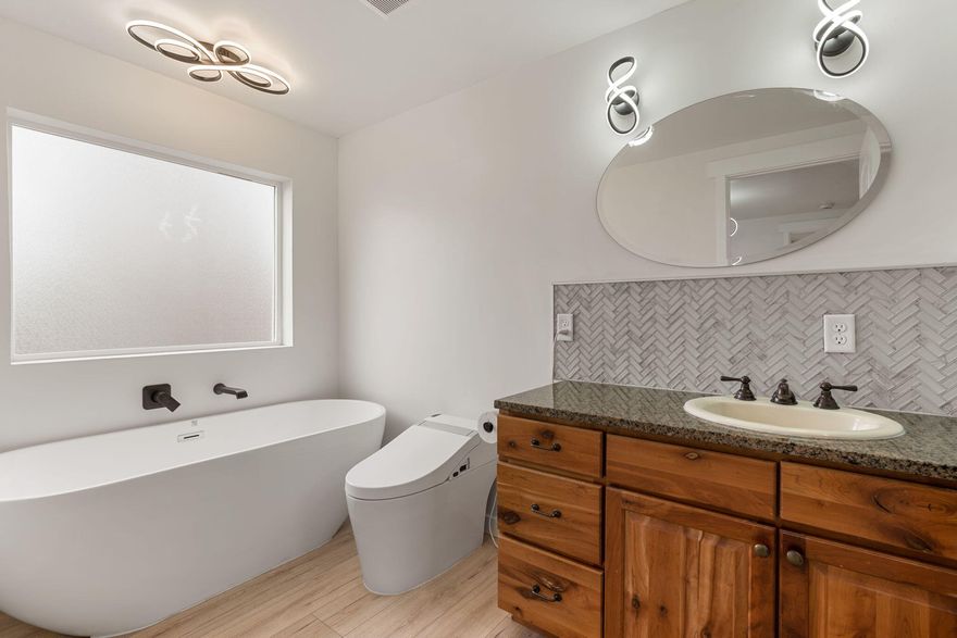 This move-in-ready home has been completely redone with over $80,000 in materials and fully permitted work by licensed professionals. Updates include: new HVAC, electrical, plumbing, windows, siding, metal roof, sheetrock, doors, flooring, paint, carport, and appliances.

Interior features include granite countertops, wood-faced cabinets, stainless steel appliances, a full-size soaking tub, and bright open-concept living with large new windows. The kitchen and pantry offer excellent space compared to similar homes.

Additional highlights:
-6'' exterior walls with upgraded insulation
-Large landscaped yard with automatic watering
-Covered parking
-8x12 shed with cabinets/countertops

Located in Canyon View Mobile Home Park. Lots are rented, so no property taxes.