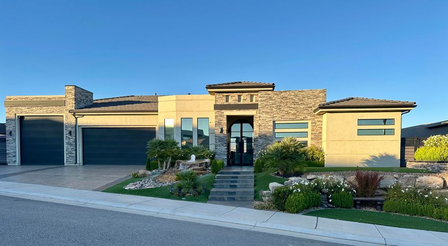 OMG!!! This home is LOADED with upgrades and high-end features. Step inside this masterpiece and the VIEWS will literally take your breath away!  The owners have lovingly thought of everything to make this home sparkle.  The exterior has been upgraded with a new front door and windows.  The concrete has been coated, garage floor epoxied.  The yard customized with fountains, artificial turf and gorgeous shrubs and plants.  The grand living space opens up to a stunning pool/hot tub with views in every direction.  The gourmet kitchen will not disappoint.  The home has a grand primary bedroom with lots of windows to see the amazing views , from the bedroom to the bathroom.  The custom closet features enhance the large closet.  There is a nice office with a custom barn door as well as 2 add additional bedrooms and 1 full bath and a 1/2 bath.  The garage is a MAN CAVE, air conditioned, built in cabinets, epoxied flooring and a LIFT for an extra car.  (can be removed if buyer does not want it).  The yard is meticulously planned out with custom fencing and awnings.  Artificial turf  and lots of low maintenance plants make the yard work a breeze.  Do not miss out on this rare opportunity to live in a true DREAM HOME!