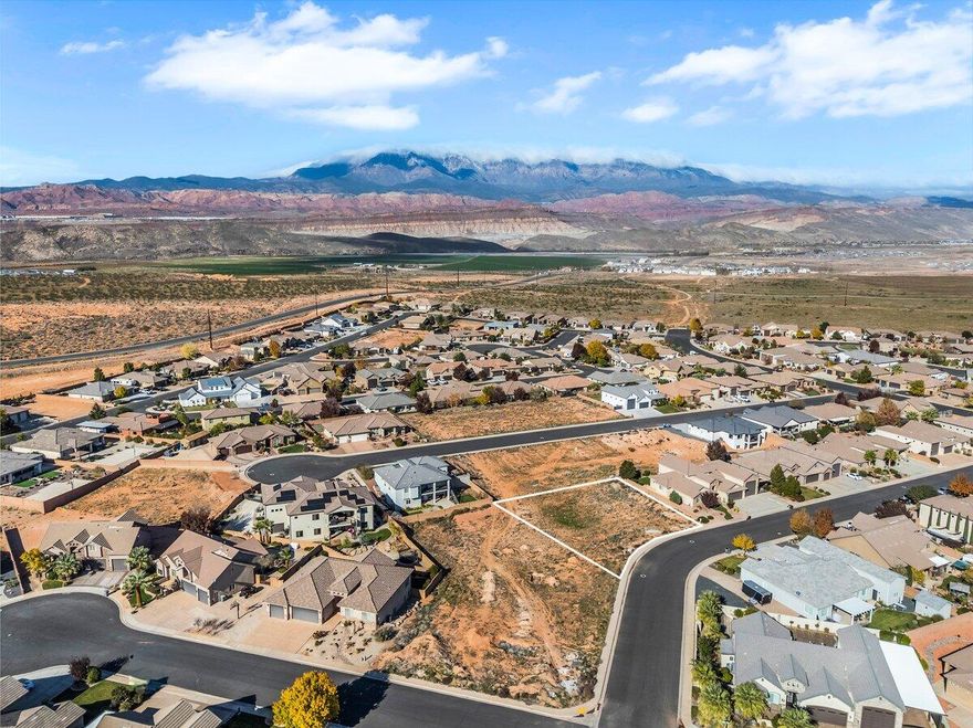 Build your dream home on this extremely rare, oversized lot in the coveted Dixie Springs community, where endless adventure and breathtaking scenery surround you. Connected Lot #169 (0.36 acre) and Lot #170 (0.3 acre) are also available for sale! This build-ready property offers stunning mountain views, no HOA, and utilities already at the lot, making it the perfect canvas for your custom home. Just minutes from Sand Hollow Reservoir, Sand Mountain dunes, and Dixie Springs Park, you'll enjoy year-round access to boating, off-roading, hiking, and pickleball. With direct side-by-side access from your own garage to a network of world-class trails, outdoor fun is always within reach. Plus, you're only a short drive from Zion National Park, top-rated golf courses, and iconic red rock landscapes, offering a lifestyle that blends recreation, convenience, and natural beauty all in one. Buyer to verify all information, deemed reliable, however buyer to verify all info including utilities, rental restrictions, and HOA information if applicable.
