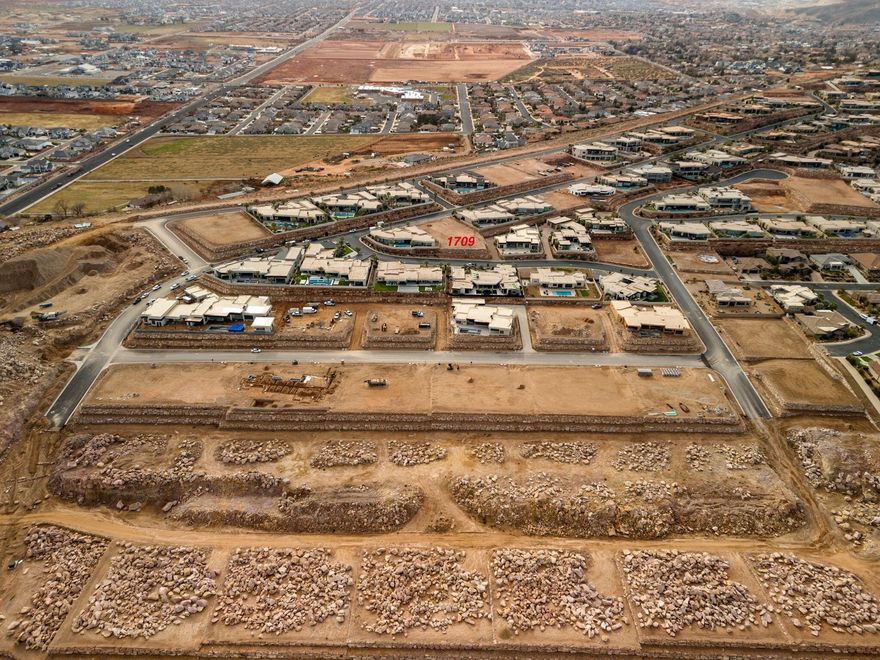 Elevated views from this secluded lot with views to the Northeast.  Includes 2 floor plans by Paradise Design one is 8582 SQ with 4 car plus RV garage 2627 SQ and the smaller floor plan is  5935 SQ with 3 car plus RV garage 1696 SQ garage. The water impact fee has already been paid, bring any builder.