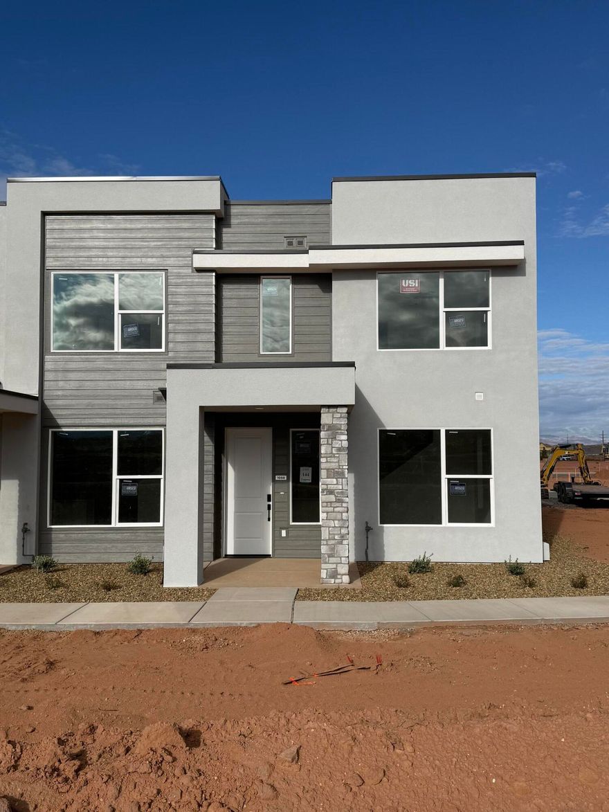 This inviting 3 bedroom, 2.5 bathroom townhome boasts a prime location just moments away from Zion Shores surf park, Warner Valley, and Sand Hollow making it perfect for outdoor enthusiasts and adventure seekers. The spacious living area flows seamlessly into a well-appointed kitchen complete with stainless steel appliances. The generous primary bedroom is complete with an en-suite and walk in closet. Two additional bedrooms provide plenty of space for guests, a home office, or hobbies and they share a stylishly designed full bathroom. A convenient half-bath is located on the main level.