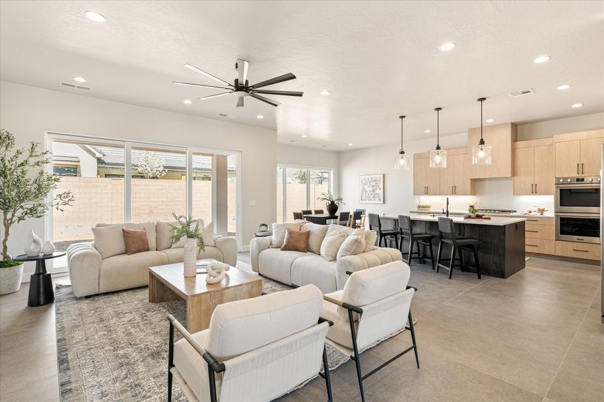 Every finish in this home has been thoughtfully curated to create a true custom feel. A stunning 3-sided fireplace and two sets of triple sliding doors seamlessly blend indoor and outdoor living. The primary suite is a showpiece, featuring a freestanding tub set within an expansive glass shower complete with dual heads & a hand wand. Custom cabinetry extends to the ceiling in the oversized closet,