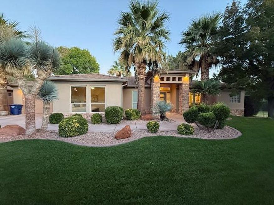 Sitting on the backside of the green for hole #3 of Black Rock at Sunbrook is the unique home you have been searching for. Positioned on a quiet cul-de-sac, mature palms and pines frame the home on one of the best Golf Courses in Southern Utah. The interior centers on an inviting great room where soaring windows capture panoramic fairway vistas. Architectural excellence is evident in the eight-foot doors and premium finishes, including durable quartz, granite, and a stone-clad fireplace. Modern conveniences like remote blinds, central vacuum, and a monitored alarm system ensure effortless living. The expansive primary suite provides a secluded retreat, while the large den offers professional workspace versatility. Beyond the epoxy-floored garage and lush grounds, the HOA provides indoor and outdoor pools hot tub, clubhouse and fitness center. Turn-key designer furnishings are negotiable. Reach out to the listing agent for a private tour.