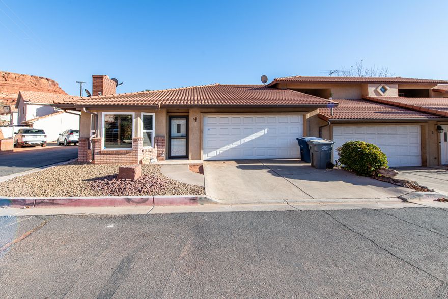 Fantastic location close to shopping centers, restaurants, walking & biking trails & very convenient to downtown St. George!  This 2 Bedroom 2 Bathroom home includes a 2 car garage, & has a few newer updates, like fresh paint, newer appliances, windows, water heater, some new flooring, AC unit, alarm system can be connected, washer/dryer & fridge are included .  Cozy, cute and charming little place you can make your own.