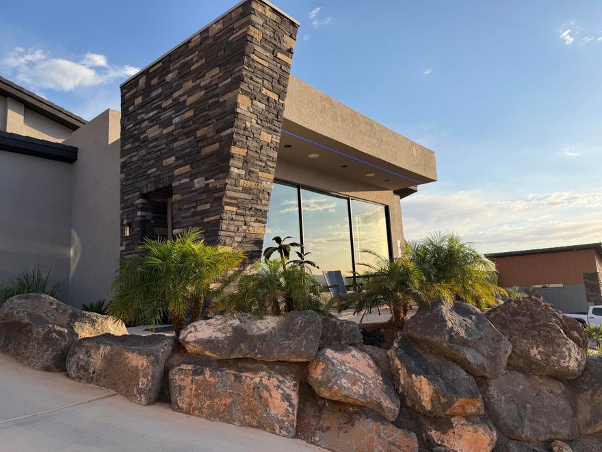 DESERT MODERN MASTERPIECE WITH PANORAMIC VIEWS. Experience the pinnacle of contemporary luxury in this custom designed architectural marvel. Perched high to command breathtaking, unobstructed views, this estate blends dramatic modern design with functional, high-end living. Resort style bathrooms with jaw dropping walk in showers.  The homes exterior showcases a beautiful mix of warm desert stucco, clean architectural overhangs with integrated lighting, and massive stacked-stone pillars. This is more than a home: it's a design forward lifestyle statement. Perfect for the buyer who demands bold architecture, premium finishes, and unparalleled views.
The back yard and RV Garage have renderings available or it can be completed to your clients wants and needs.
OWNER AGENT!!!!