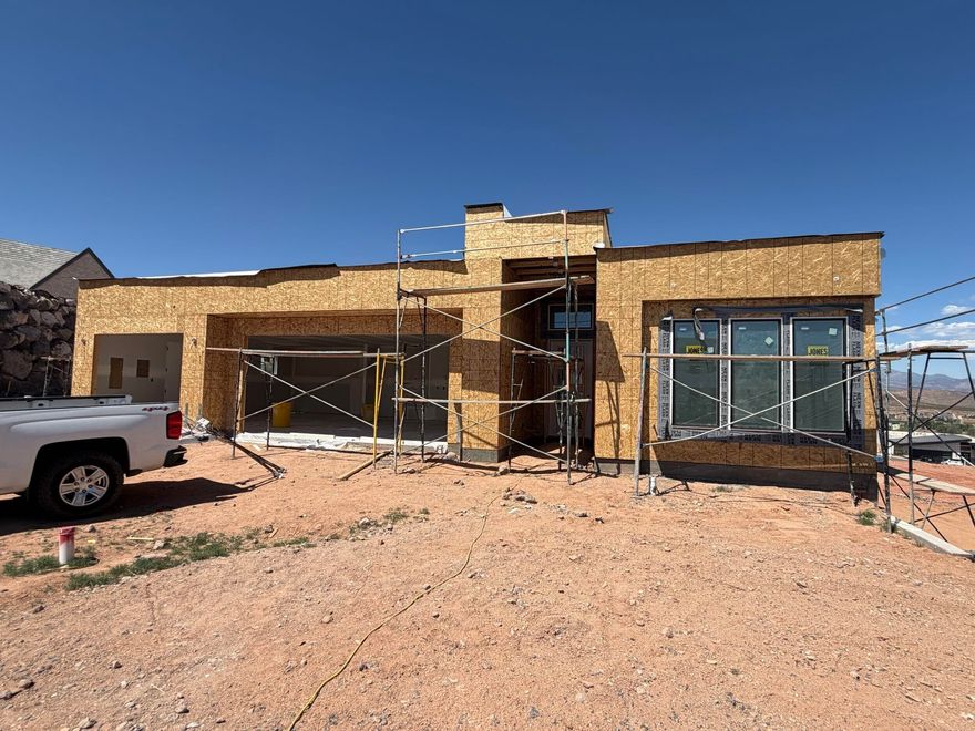 Imagine having a view from almost every window! This home sits on a special lot and is positioned to take advantage of the Southern Utah views out of almost every window. Projected date of completion is August 2026. Schedule your showing today!