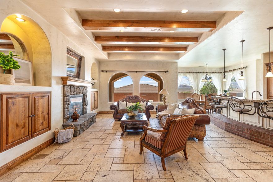 Your perfect Tuscany retreat in the heart of Ivins awaits! This home truly has it all — from the sparkling pool and private courtyard with gorgeous views, to the oversized 4-car garage that fits all your gear. The home features a remarkable multi-level layout perfect for entertaining and creating memories with family and friends. At the entrance, you are welcome by the serene sounds of the water feature in the large courtyard. Once you walk through the large arch glass wooden doors, you will experience a large open floor concept that includes the large upstairs living room, kitchen, and dining area with large mountain view windows. The home features 5,544 SqFt (2,772 on each floor), 6 bedrooms, 6 bathrooms, theater room, 2x flex rooms, Office/Den, large storage room, granite honed edge countertops throughout, and wood beam living room ceilings. Inside, the kitchen is a chef's delight with a large multi-tier island, a built-in fridge, and a hidden pantry big enough for all your needs, knotty alder cabinets, 6 burner chef freestanding stove, and built-in swivel island chairs. The spacious primary bedroom is a relaxing escape, complete with its own secluded flex room, a custom built-in closet, a spa-like bath with a triple-head shower, separate soaking tub, and large sauna room. The finished basement has a large 2nd living room that is perfect for a game room. Movie nights? This home has you covered, thanks to your very own theater room. You'll also love the large mudroom, laundry space, kitchenette, and a den perfect for work or hobbies. The outdoor space is a wonderful entertainment space with Outside, fire up the built-in barbecue and fridge under the covered patio, and enjoy effortless entertaining. 

Home is in the review process of getting approval for short sale. Please call for more information.

The home is near the Greater Saint George paved bike/walking trail system with over 50 miles that connects you across the city, including the iconic Snow Canyon State Park, Sullivan Soccer Park, and miles of beautiful Red Rock terrain. Minutes from amenities in downtown Saint George, such as over 16 golf courses including Black Desert Golf Course home to the Fall 2024 PGA TOUR's FedEx Cup, hiking and cycling trails, and a short drive to some of America's most awe-inspiring places; National parks Zion, Bryce and the north rim of the Grand Canyon, and state parks like Sand Hollow Reservoir, Gunlock Reservoir, Quail Creek Reservoir, and nearby Dixie National Forest. The City of Ivins is known for its low light pollution initiative to protect its night sky and for its breathtaking views of Red Mountain. There is no doubt that the word is out that at 2,700 feet above sea level, on the edge of the Mojave desert, Colorado Plateau, and the Great Basin, lies one of America's most beautiful and distinctively geological places, Saint George! No other place says that you have arrived than this beautiful home.

All information herein is deemed reliable but is not guaranteed. The buyer is responsible to verify all listing information, including square feet/acreage, to the buyer's own satisfaction.