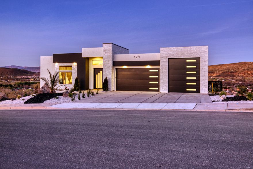 Experience luxury desert living in this stunning new construction home in the highly sought-after Hillside Estates, featuring unobstructed views of Zion and surrounding landscape. Designed for those who appreciate refined living and unforgettable scenery, this 5-bedroom, 5-bath residence offers the perfect balance of sophisticated design, comfort, and resort-style amenities.  

The gourmet kitchen is a chef's dream with premium Café appliances, custom cabinetry, and a spacious butler's pantry--designed for effortless entertaining and elevated everyday living.  Expansive windows frame the dramatic landscape while filling the home with natural light. 

The home features two spacious living rooms, including a walk out lower-level living space with kitchenette that opens directly to the outdoor entertaining area, ideal for hosting pool parties or multi-generational living.

Step outside to your private backyard oasis with a sparkling pool, hot tub, and dedicated pool bath, all set against a stunning backdrop of Southern Utah's desired mountainous scenery.  A large elevated deck provides the perfect setting for sunset dinners, morning coffee, or simply taking in the breath taking panoramic views of Zion.

Additional highlights include an RV garage offering ample space for recreational vehicles, boats and adventure gear. 

This exceptional Hillside Estates property is more than a home - it's a luxury retreat designed for those seeking privacy, views, and elevated living in one of the region's most desirable hillside communities.