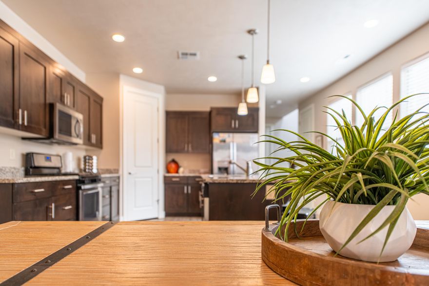 This stunning home is located in the highly sought-after Paradise Village at Zion, a top-rated vacation home community in Utah, zoned for short-term rentals. Whether you're looking for a property to self-manage or utilize a property manager, this is the perfect location to own a second home and enjoy additional income when not using it. 
This townhome features a total of 3 bedrooms, 3 full bathrooms, and 1 half bathroom, in the thoughtfully planned 2098 SF floorplan.  Both water heaters were recently replaced, and the home is ready for new owners. Paradise Village boasts exceptional amenities, including two expansive pool areas, relaxing spas, a lazy river, Kid's Cove water slides and dumping buckets, fitness room and clubhouse, ample green spaces, and two large RV parking areas, high-speed fiber internet.

For additional recreation, the community offers direct access to Santa Clara City's Gubler's Park, featuring pickleball courts, sand volleyball, soccer fields, baseball fields, a splash pad, basketball courts, pavilions, playgrounds, and scenic walking/biking trails. Enjoy breathtaking views of Pine Valley, Snow Canyon, and the Palisade Mountains from your doorstep, with Harmons Grocers and several restaurants nearby for added convenience.

Located just minutes from St. George, Zion National Park, Tuacahn Outdoor Amphitheater, Snow Canyon State Park, and world-class golf courses, Paradise Village is perfectly positioned to offer both residents and guests an unforgettable experience. Plus, you're only a half-day drive from spectacular destinations like Bryce Canyon National Park, Canyonlands National Park, Brian Head Ski Resort, and the Grand Canyon.

Don't miss this rare opportunity to own a home in one of Southern Utah's premier vacation communities. Experience all the beauty, recreation, and comfort Paradise Village at Zion has to offer!
Home is being sold fully furnished.