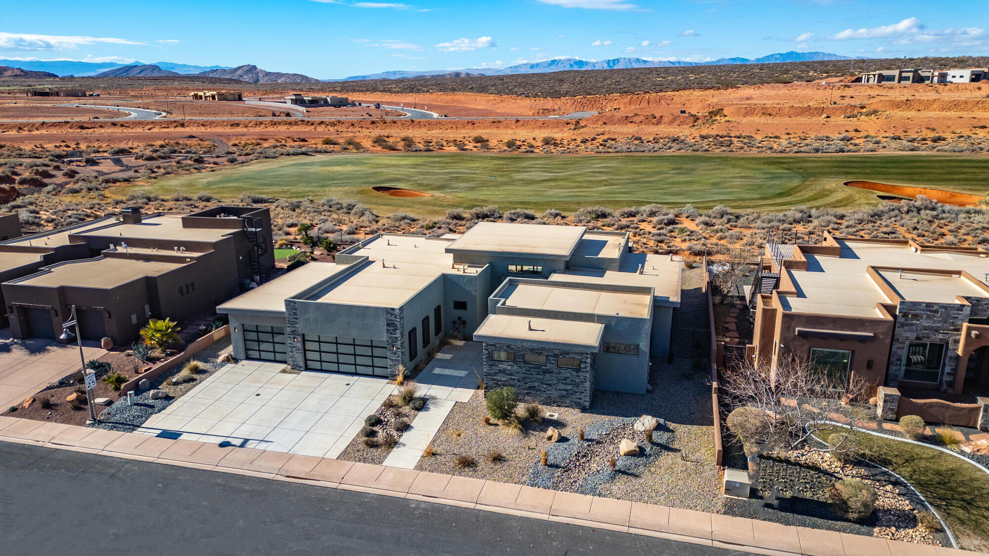 Welcome to your dream home on Hole #17 of the prestigious Sand Hollow Golf Course. This stunning 4-bedroom, 4.5-bathroom residence spans 3,151 sq. ft. of elegant, thoughtfully designed living space, perfectly blending indoor and outdoor living. Step inside to find soaring ceilings that create a bright and airy atmosphere, while the gourmet kitchen, equipped with Bosch appliances and a spacious butler's pantry, is a chef's dream. Each bedroom features an en-suite bathroom, ensuring comfort and privacy for all.  
Outdoors, enjoy serene views of the lush fairways from your covered patio, perfect for entertaining or relaxing in style. Located just minutes from Sand Hollow State Park and other breathtaking natural amenities. this home provides the ideal balance of luxury and adventure.  Your oasis awaits- furniture package may be available, depending upon purchase price. Bring your pets! Dog wash in the garage.