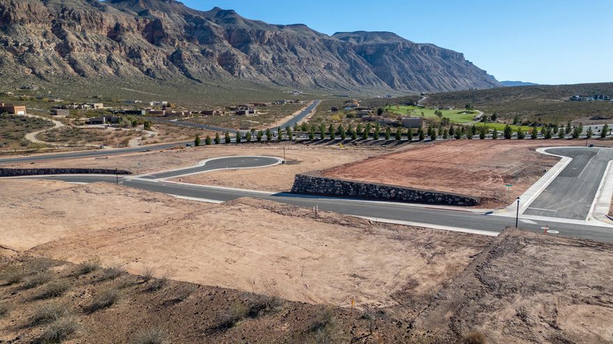 Discover The Views at Hurricane Cliffs — where modern living meets iconic Southern Utah scenery. These premium, oversized lots showcase sweeping panoramas of red rock cliffs, desert mesas, and wide-open skies. Tucked into a quiet elevated setting with direct access to world-class hiking, biking, golfing, and off-roading, yet only minutes from shopping, dining, and everyday conveniences — this community delivers the best of both adventure and comfort. Each homesite is strategically positioned to maximize privacy, views, and natural light, creating the perfect foundation to design and build your dream home. Buyers have the opportunity to work with an exclusive group of approved builders known for exceptional craftsmanship, custom design, and seamless build processes. These experienced local builders are dedicated to creating homes that blend effortlessly with the landscape while capturing your personal style and vision.

The Views at Hurricane Cliffs offers a rare chance to build in one of Southern Utah's most breathtaking and fast-growing areas. Come walk the lots, take in the scenery, and imagine your future home in this unforgettable setting.