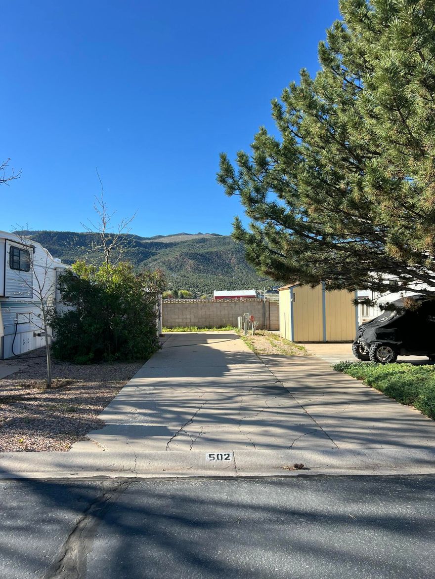 Premier RV Lot for sale in Foothills RV Park. Why rent an RV spot when you could buy? This rare, premier lot borders the outside edge of the park for spectacular mountain views! The lot is fully equipped with a storage shed, water, power, and sewer hookups. Low monthly HOA fees of $109/month cover snow removal, water, sewer and garbage. Foothills RV Park offers a quiet, clean community of just 146 lots, complete with its own clubhouse. The clubhouse offers laundry, showers, and a kitchen. Located in rural Parowan near top outdoor recreation--skiing, mountain biking, fishing, snowmobiling, ATV trails, and hunting. This is the perfect base for adventure seekers.