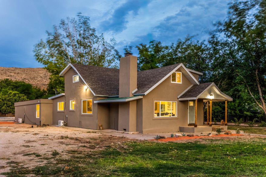 This spacious 3,263 SqFt home delivers incredible flexibility and value. It features an attached ADU, a fully renovated mother-in-law suite with its own kitchen, laundry, and private entrance, perfect for guests, extended family, or rental income. You'll also love the detached 610 SqFt structure already set up with power, water, and sewer, offering year-round comfort and endless possibilities as a guest suite, studio, or workshop. Outside, enjoy a large covered patio, a 3-car detached garage with one extra-tall bay for RVs, and an RV pad with 50-amp hookups inside and out. Recorded survey and topography already completed. Supports 2-lot split (via minor frontage variance or flag lot), or 3-lot potential with rezoning. Flat, clean site with utilities nearby.